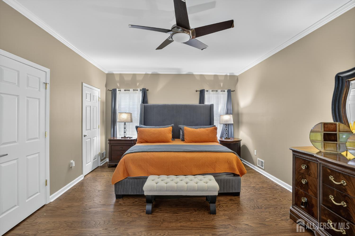 6 George Russell Way Clifton, NJ 07013 - Photo 24 of 45 a bedroom with a bed and wooden floor