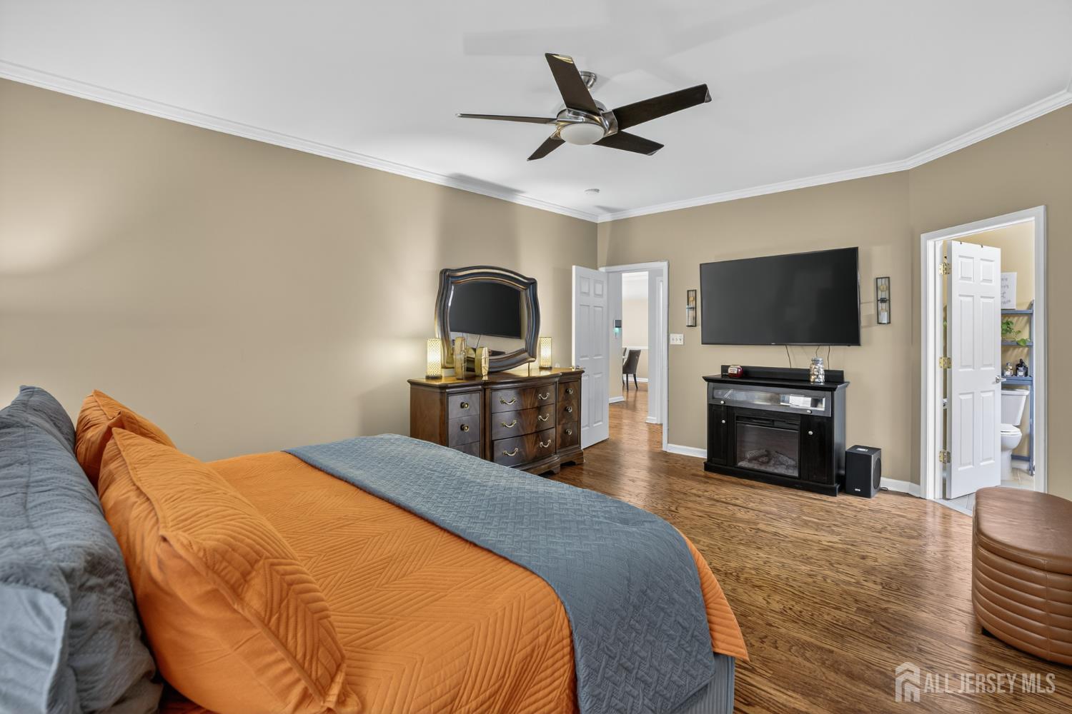 6 George Russell Way Clifton, NJ 07013 - Photo 25 of 45 a bedroom with a bed and a flat screen tv