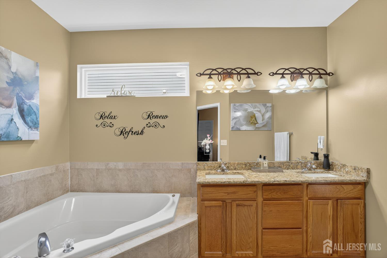 6 George Russell Way Clifton, NJ 07013 - Photo 27 of 45 a bathroom with a tub sink and mirror