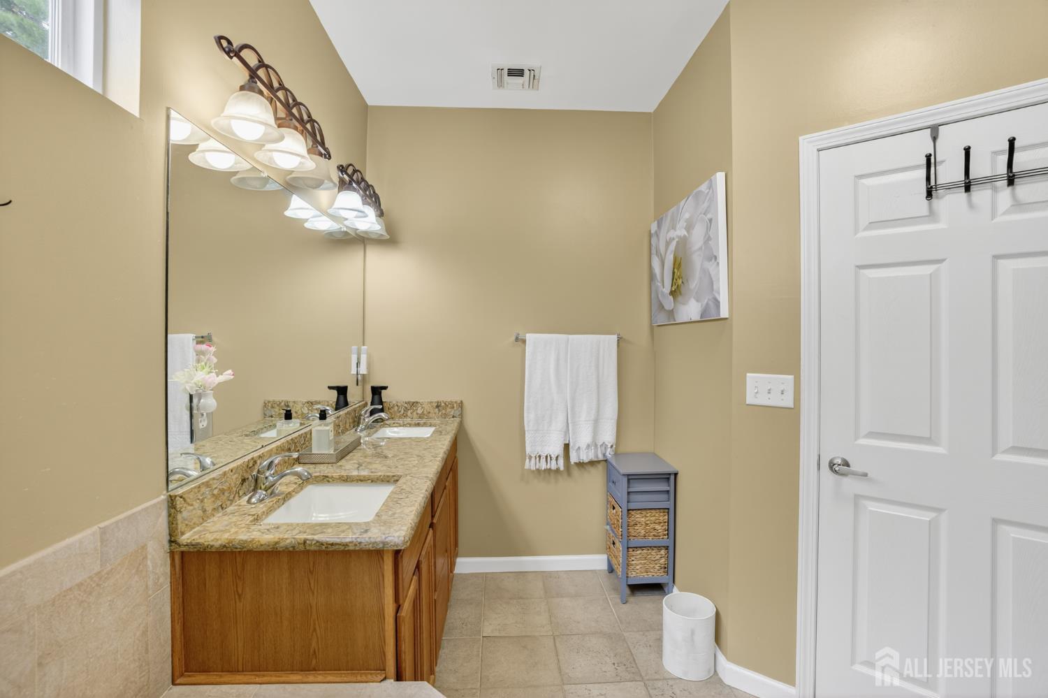 6 George Russell Way Clifton, NJ 07013 - Photo 29 of 45 a bathroom with a granite countertop sink a toilet and a mirror