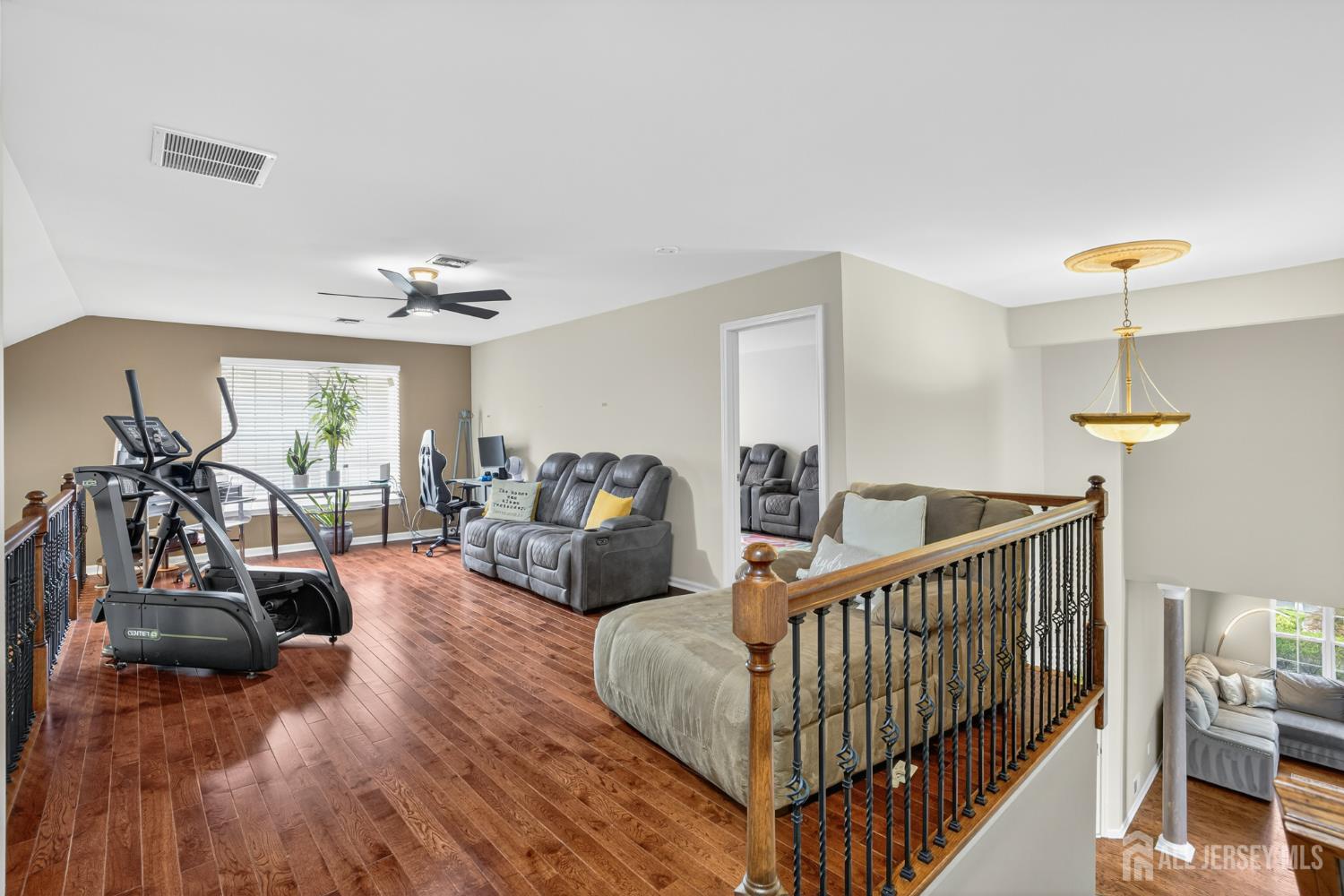 6 George Russell Way Clifton, NJ 07013 - Photo 30 of 45 a bedroom with furniture and wooden floor