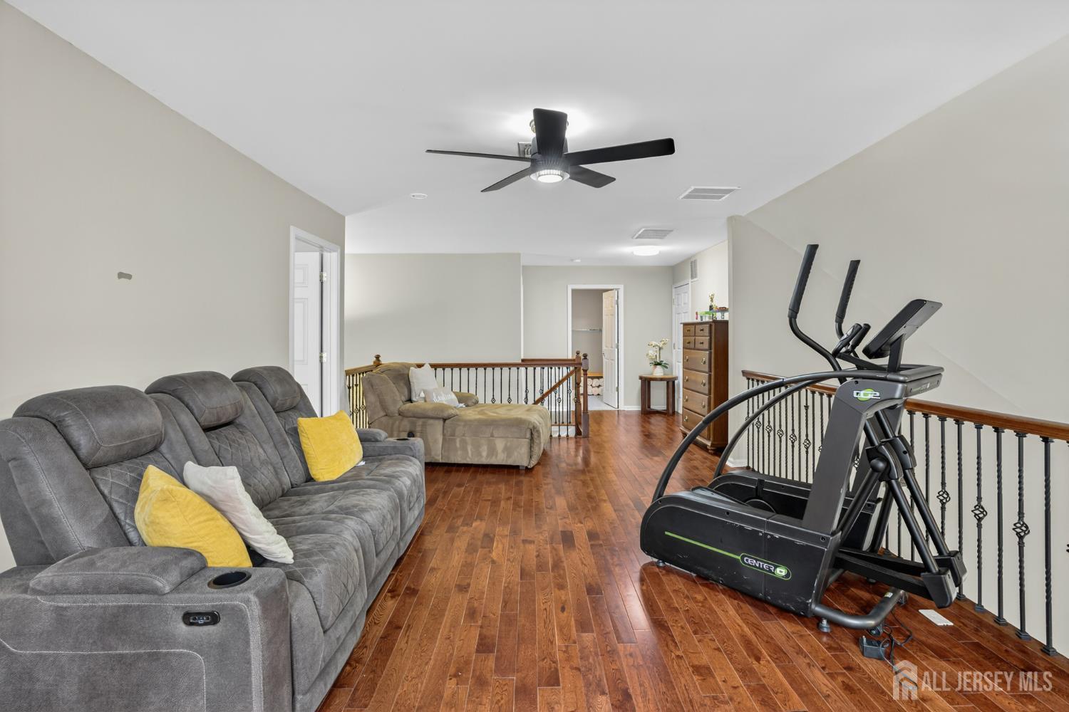 6 George Russell Way Clifton, NJ 07013 - Photo 32 of 45 a living room with furniture and a rug