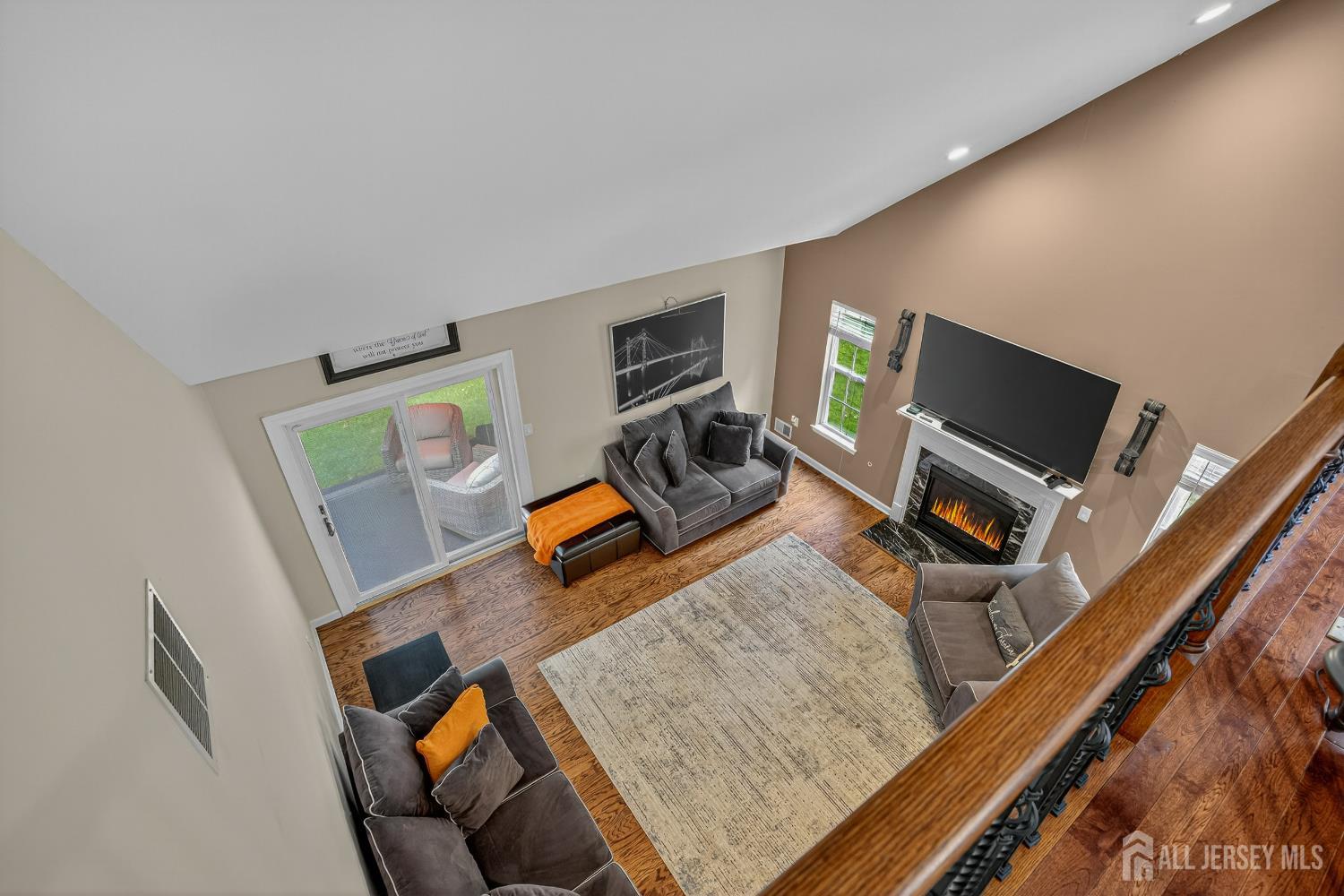6 George Russell Way Clifton, NJ 07013 - Photo 33 of 45 a living room with furniture and a flat screen tv