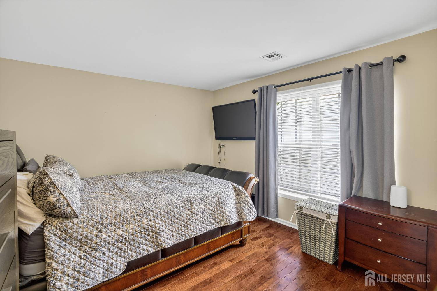 6 George Russell Way Clifton, NJ 07013 - Photo 34 of 45 a bedroom with a bed and a window