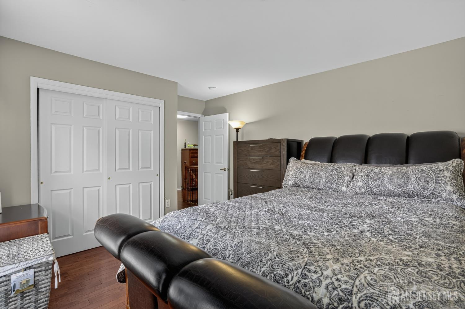 6 George Russell Way Clifton, NJ 07013 - Photo 36 of 45 a bedroom with a bed and furniture