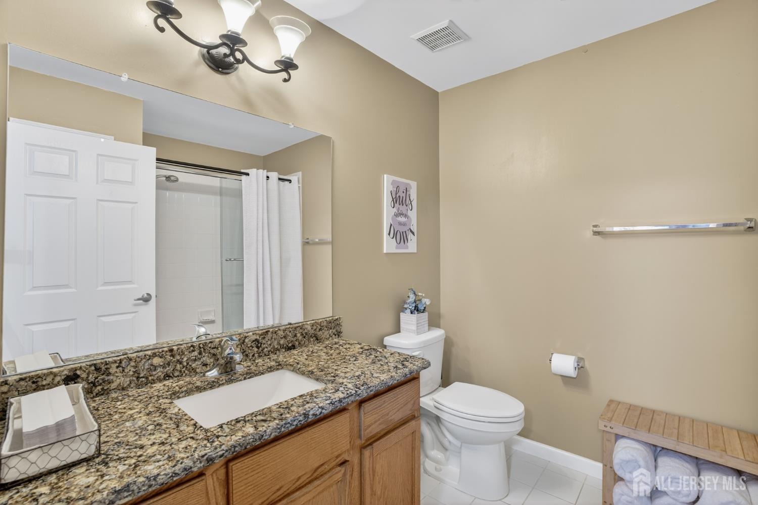 6 George Russell Way Clifton, NJ 07013 - Photo 37 of 45 a bathroom with a granite countertop sink a toilet and a mirror