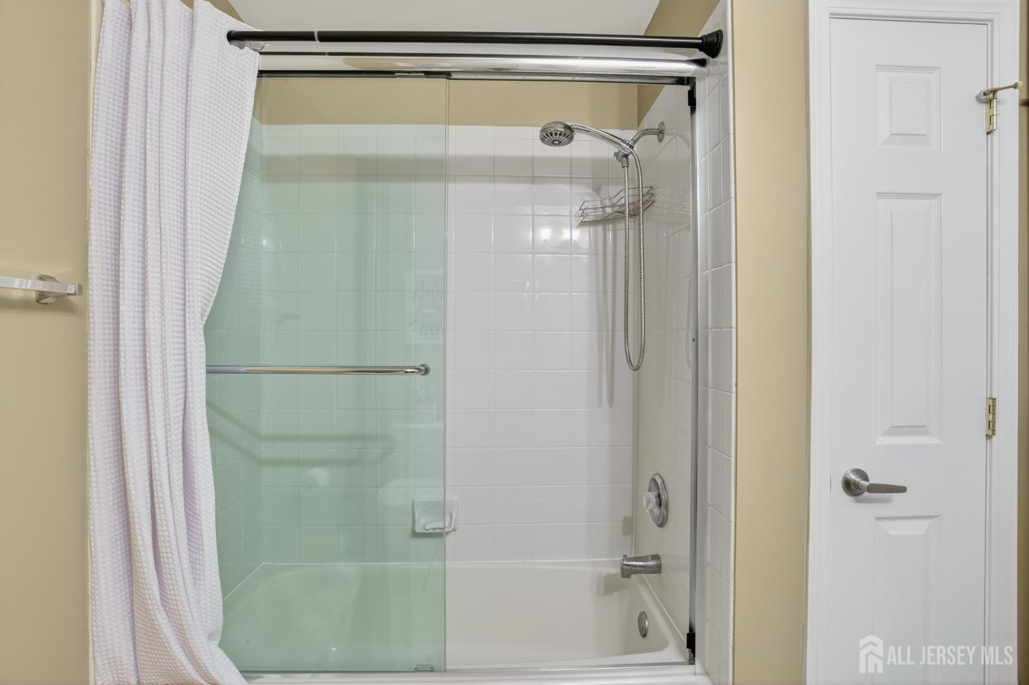 6 George Russell Way Clifton, NJ 07013 - Photo 38 of 45 a bathroom with a glass shower door