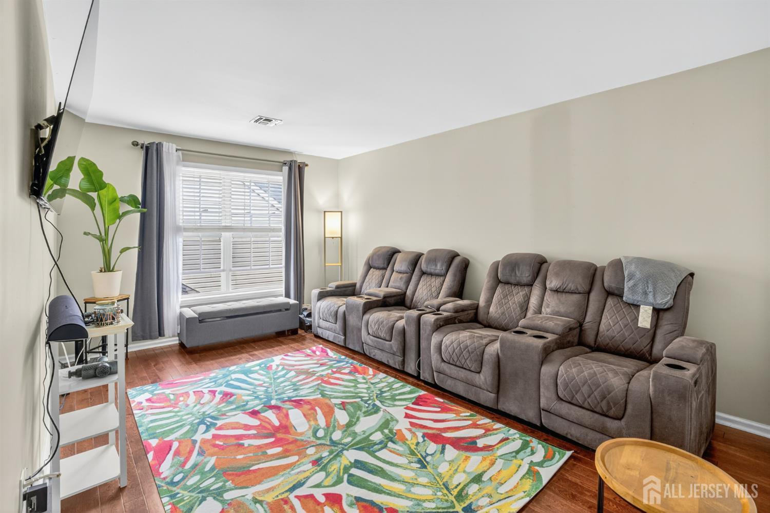 6 George Russell Way Clifton, NJ 07013 - Photo 39 of 45 a living room with furniture and a flat screen tv