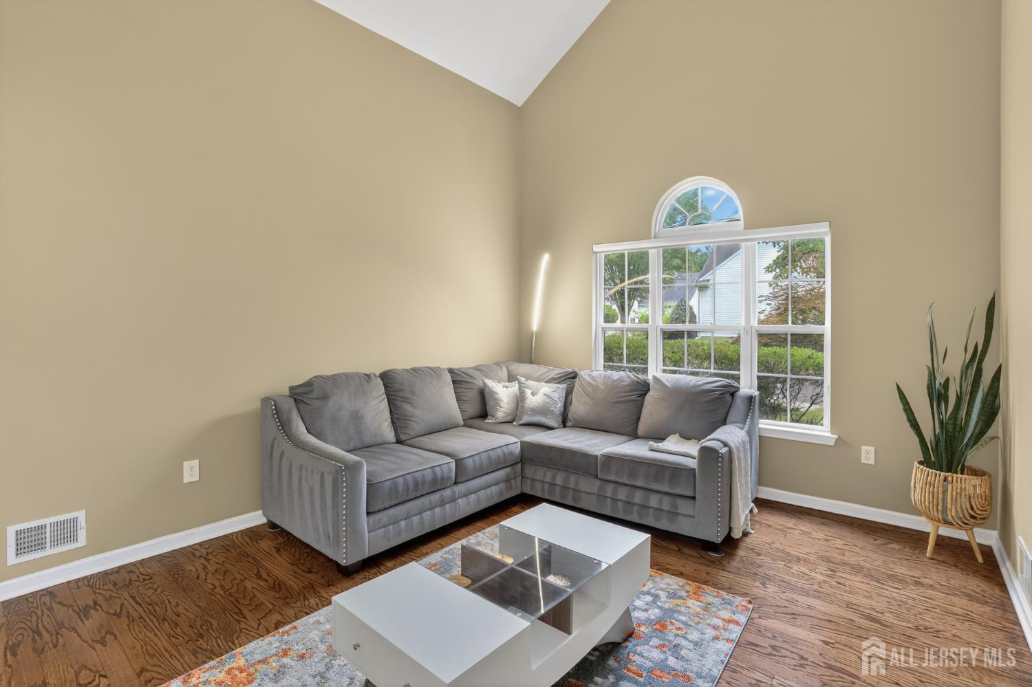 6 George Russell Way Clifton, NJ 07013 - Photo 4 of 45 a living room with furniture and a potted plant