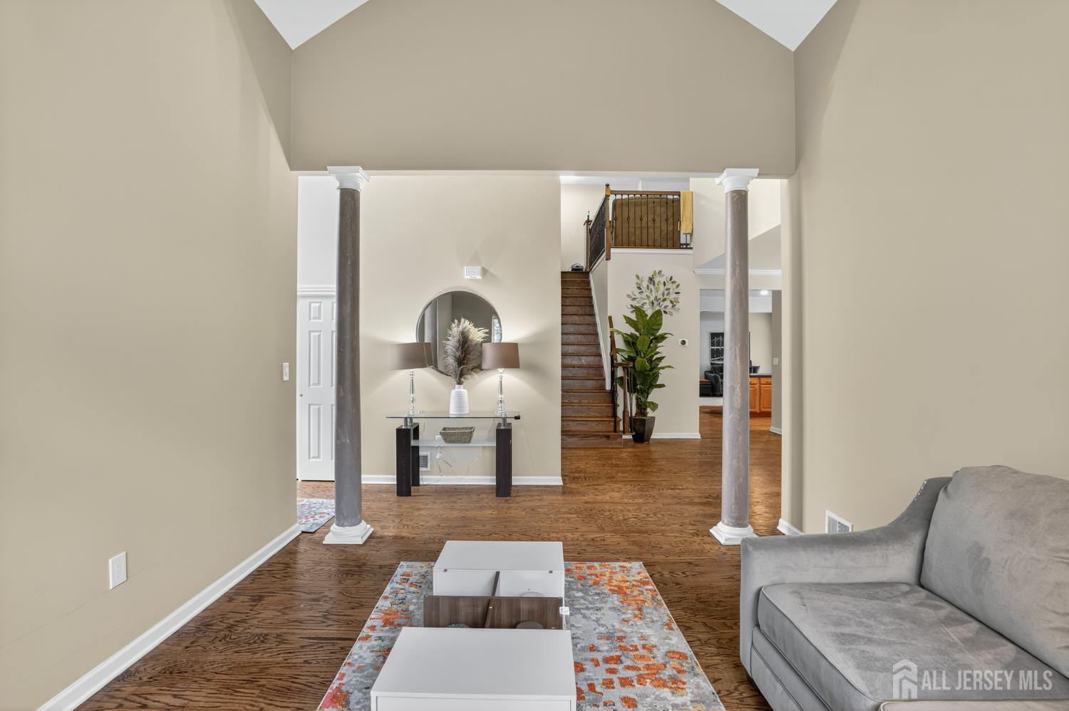 6 George Russell Way Clifton, NJ 07013 - Photo 6 of 45 a living room with furniture and wooden floor