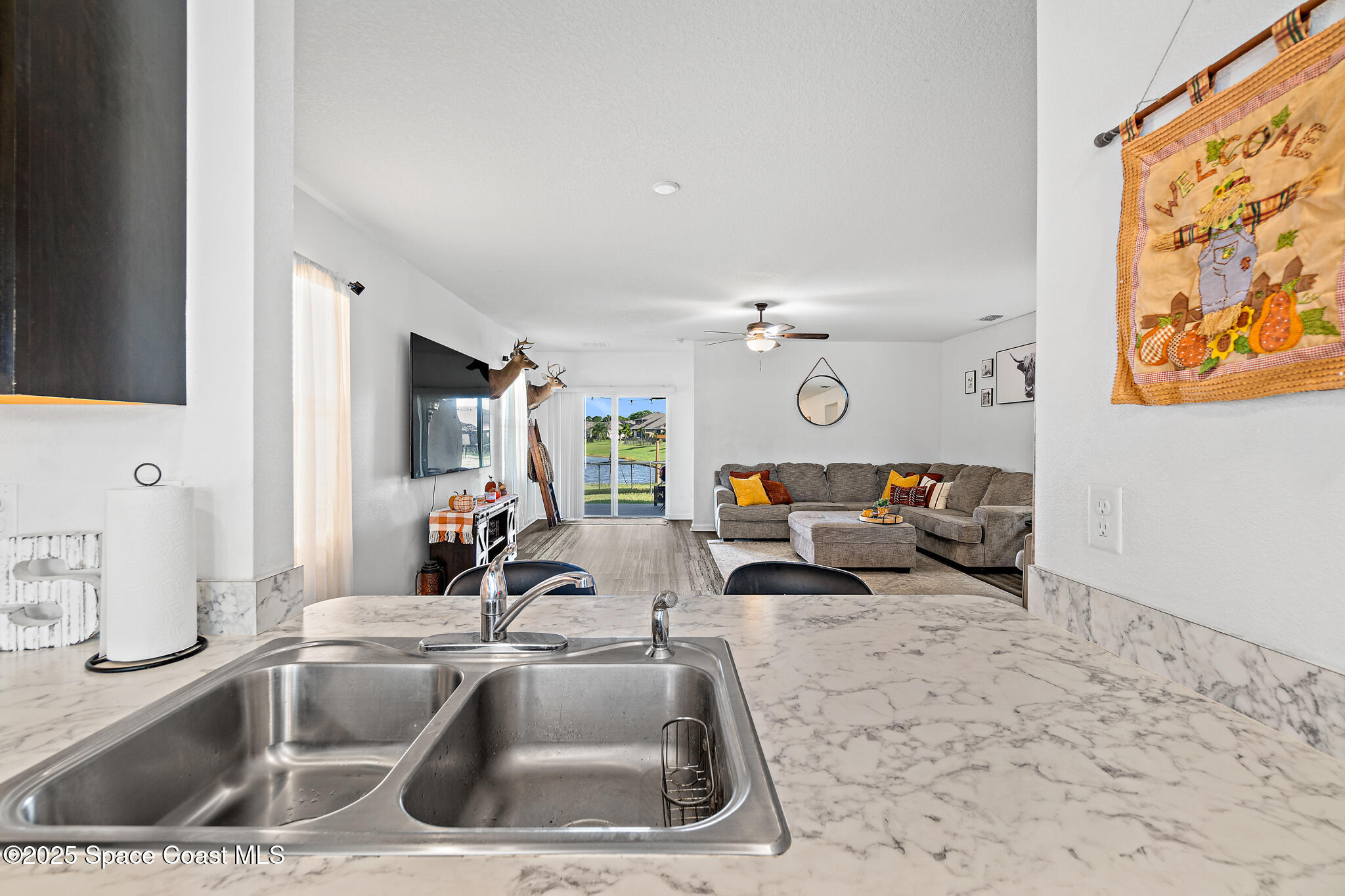 3259 Burrowing Owl Mims, FL 32754 - Photo 15 of 40 a kitchen with a sink and a refrigerator