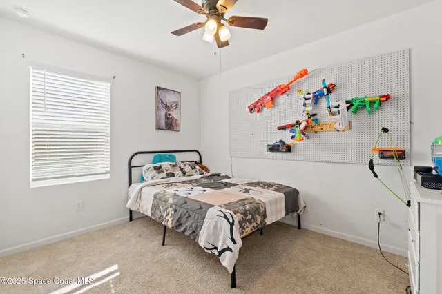 a bedroom with bed and window