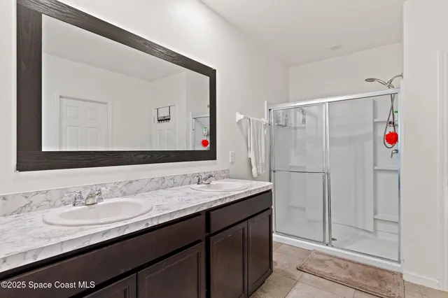 a bathroom with a sink vanity and a mirror
