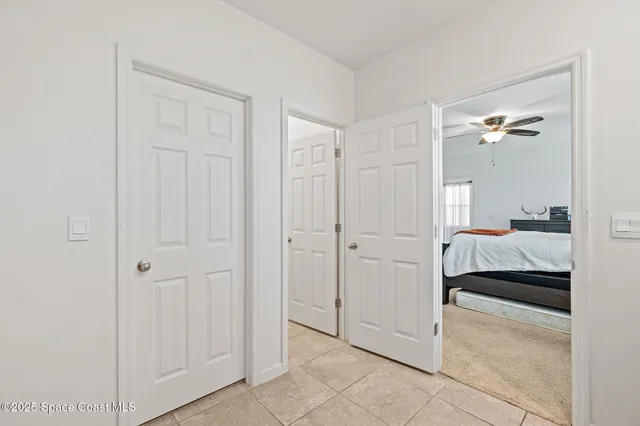a bedroom with a bed and a view of bathroom