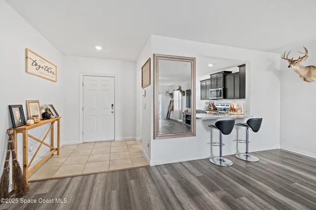 a view of kitchen with furniture and flat screen tv