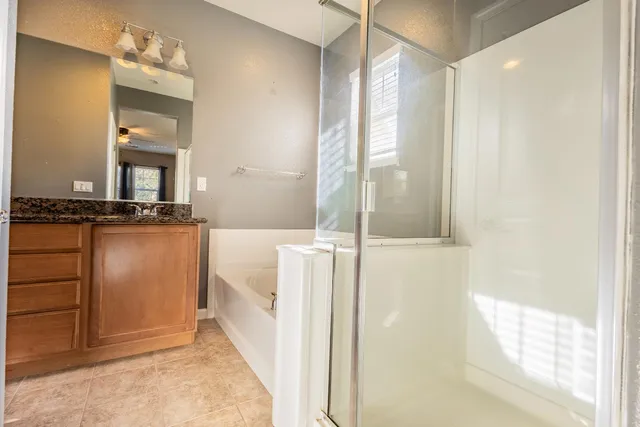 a bathroom with a bathtub and a shower