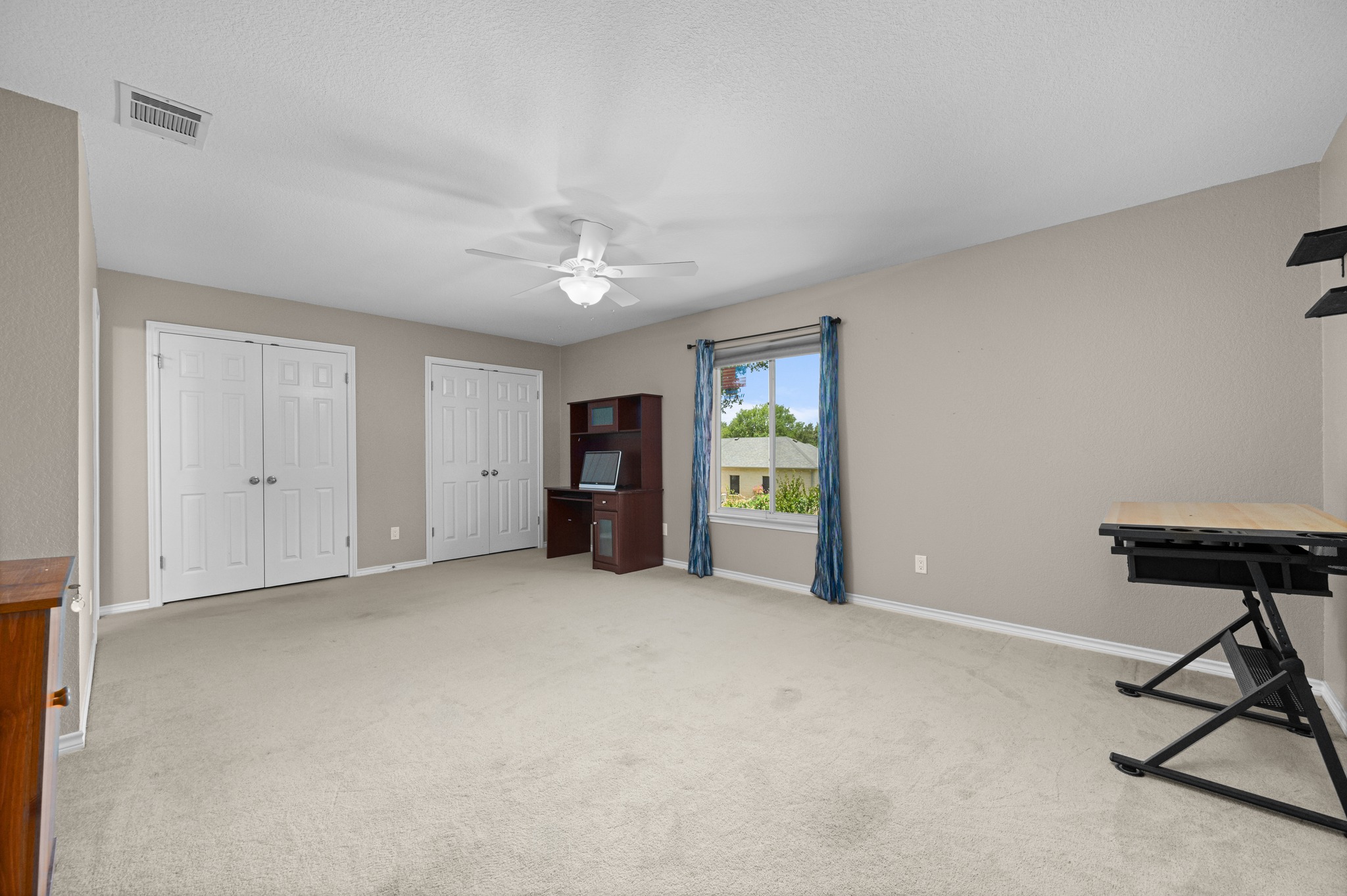 108 Thornwood Road Georgetown, TX 78628 - Photo 29 of 40 A spacious room offers ample natural illumination, perfect for a versatile living or working area.