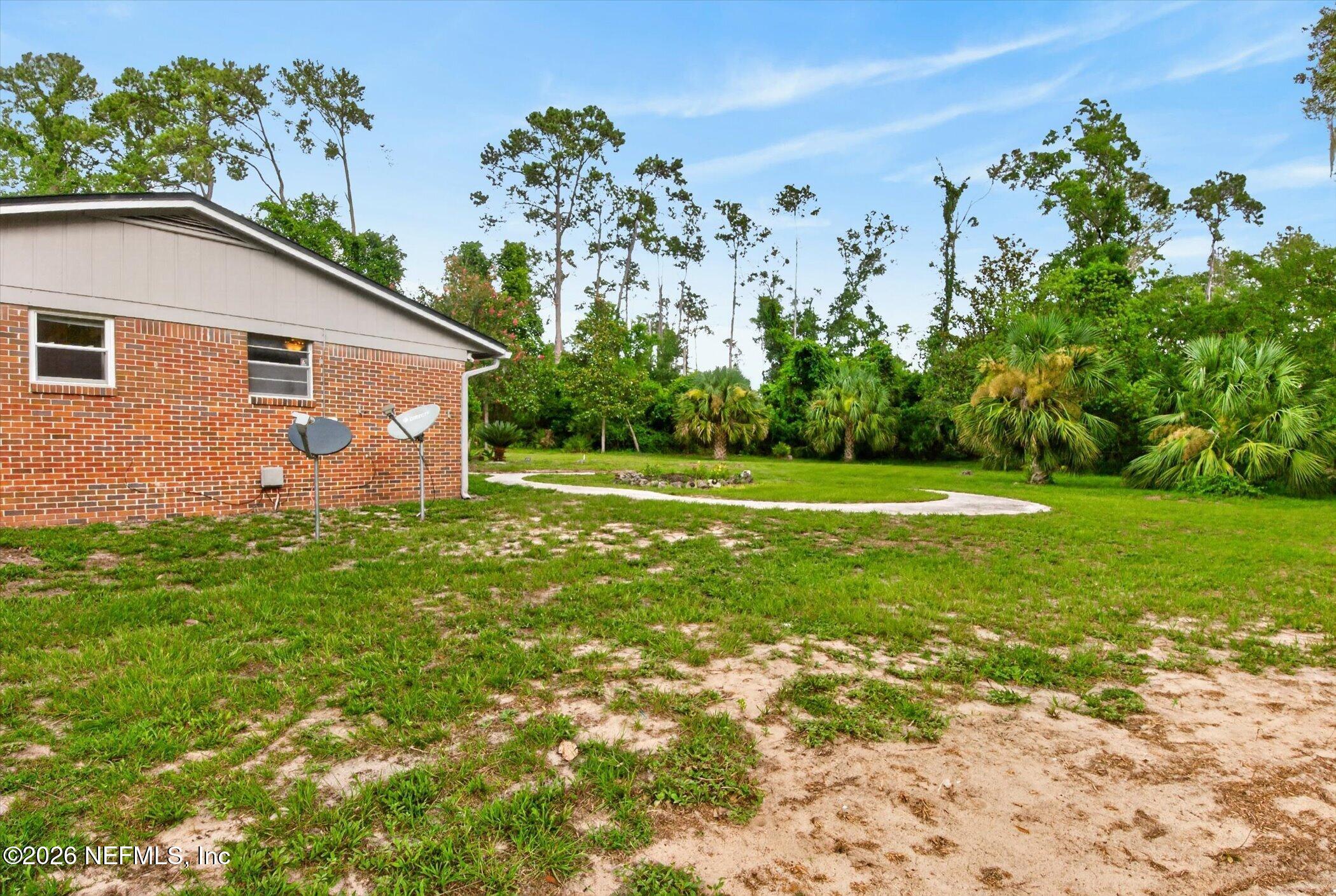 2705 Navajo Road Orange Park, FL 32073 - Photo 57 of 58 a backyard of a house with lots of green space