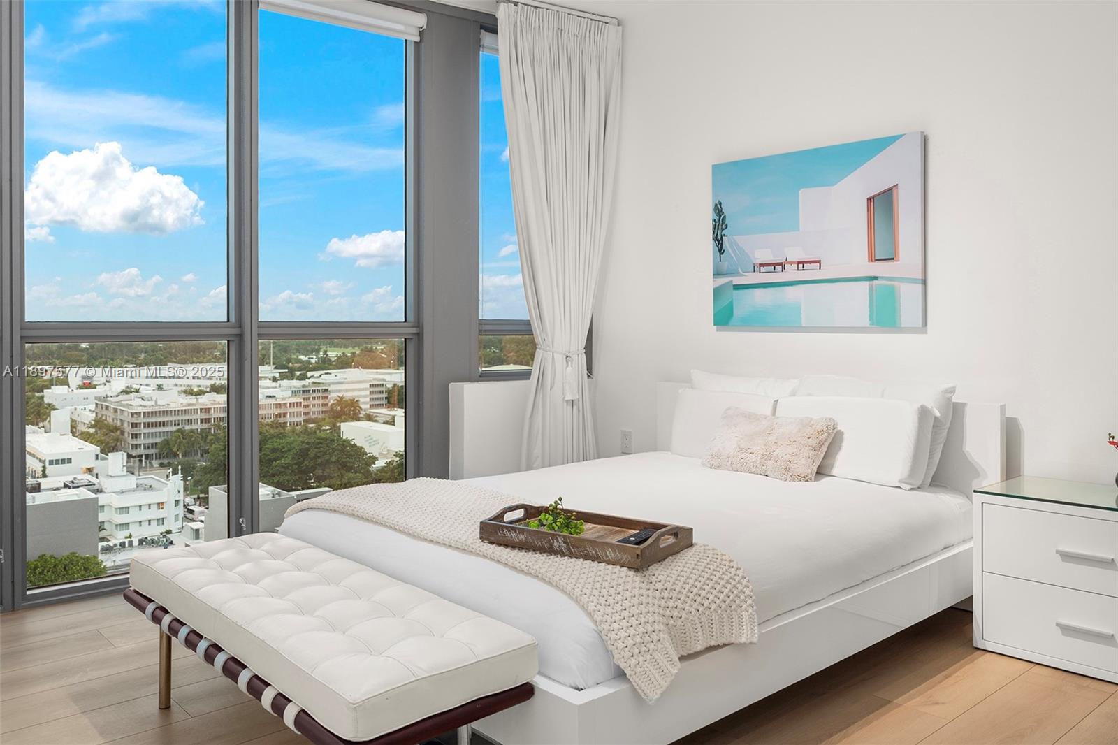 101 20th Street, Unit 2002 Miami Beach, FL 33139 - Photo 17 of 40 a bedroom with a large bed and a large window