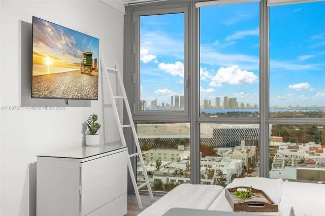 a living room with a large window and table