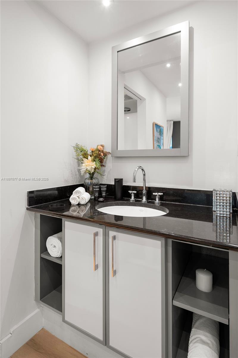 101 20th Street, Unit 2002 Miami Beach, FL 33139 - Photo 26 of 40 a kitchen with a sink and cabinets