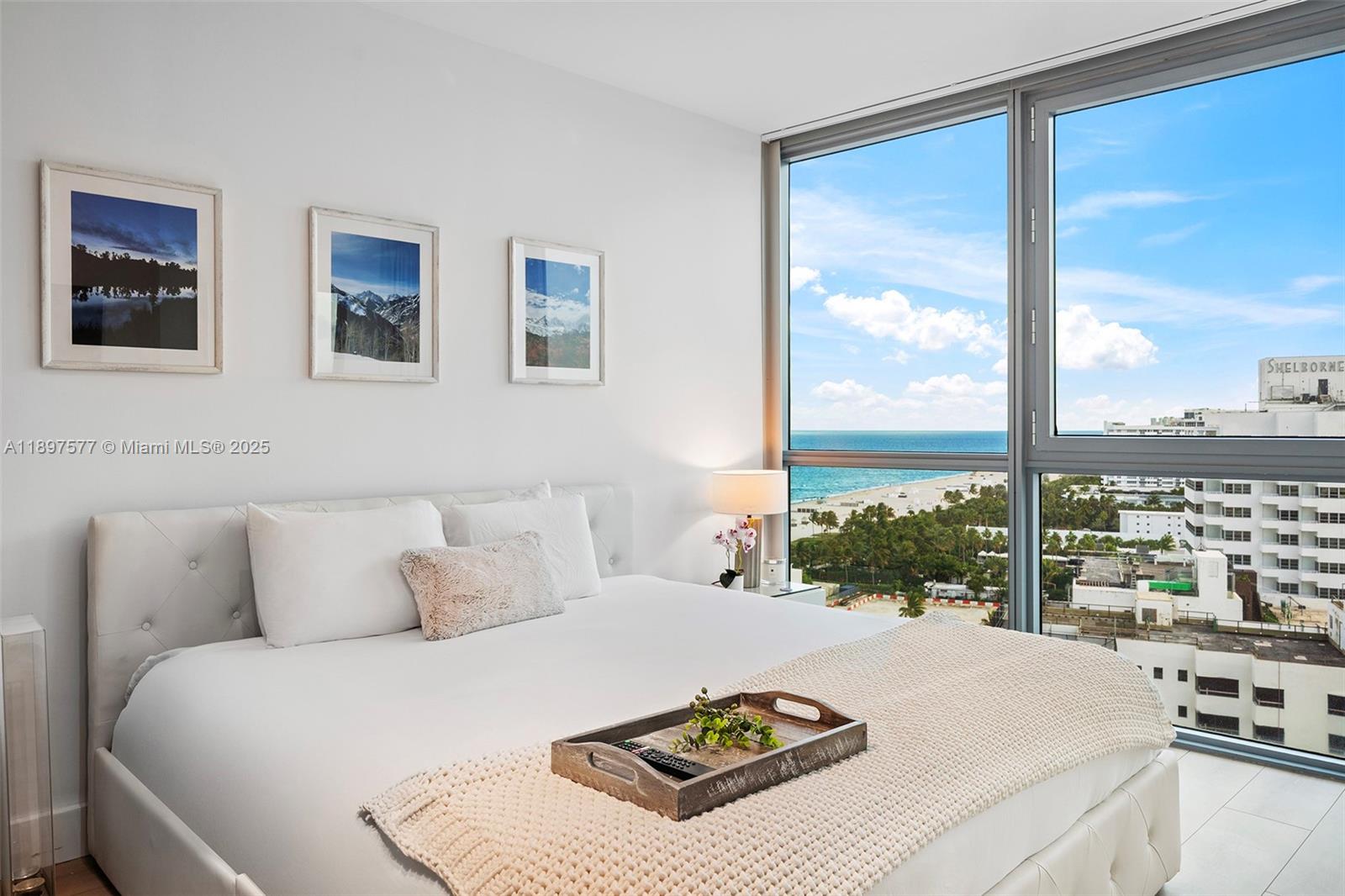 101 20th Street, Unit 2002 Miami Beach, FL 33139 - Photo 28 of 40 a bedroom with a bed and a large window