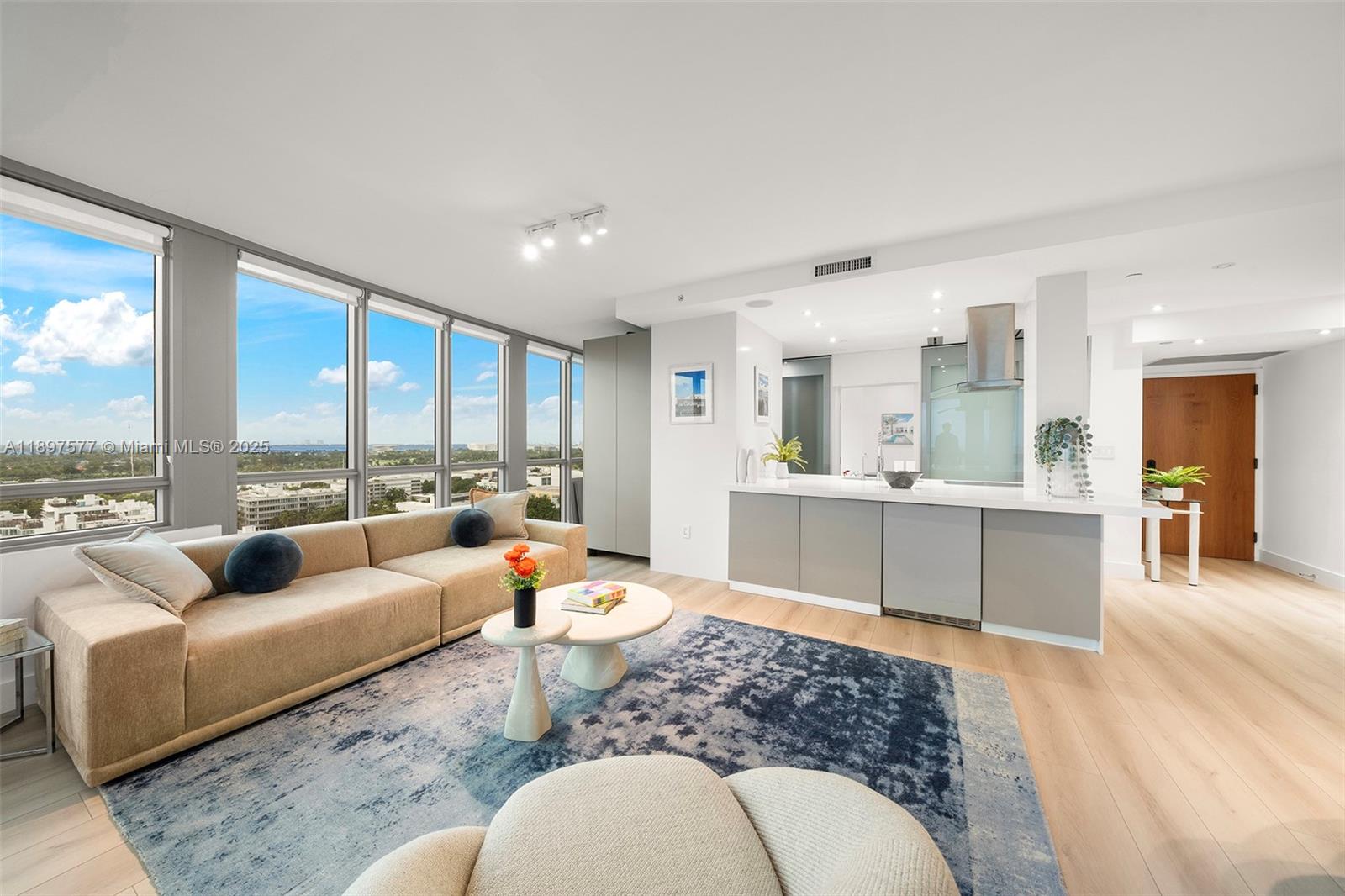 101 20th Street, Unit 2002 Miami Beach, FL 33139 - Photo 6 of 40 a living room with furniture and a large window