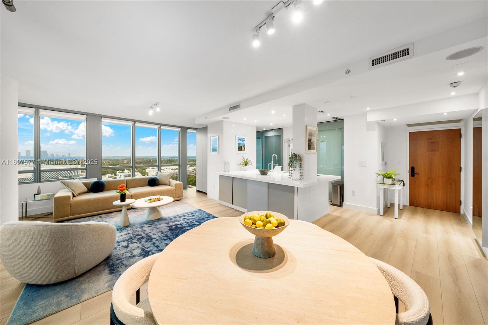 101 20th Street, Unit 2002 Miami Beach, FL 33139 - Photo 7 of 40 a living room with furniture and a large window