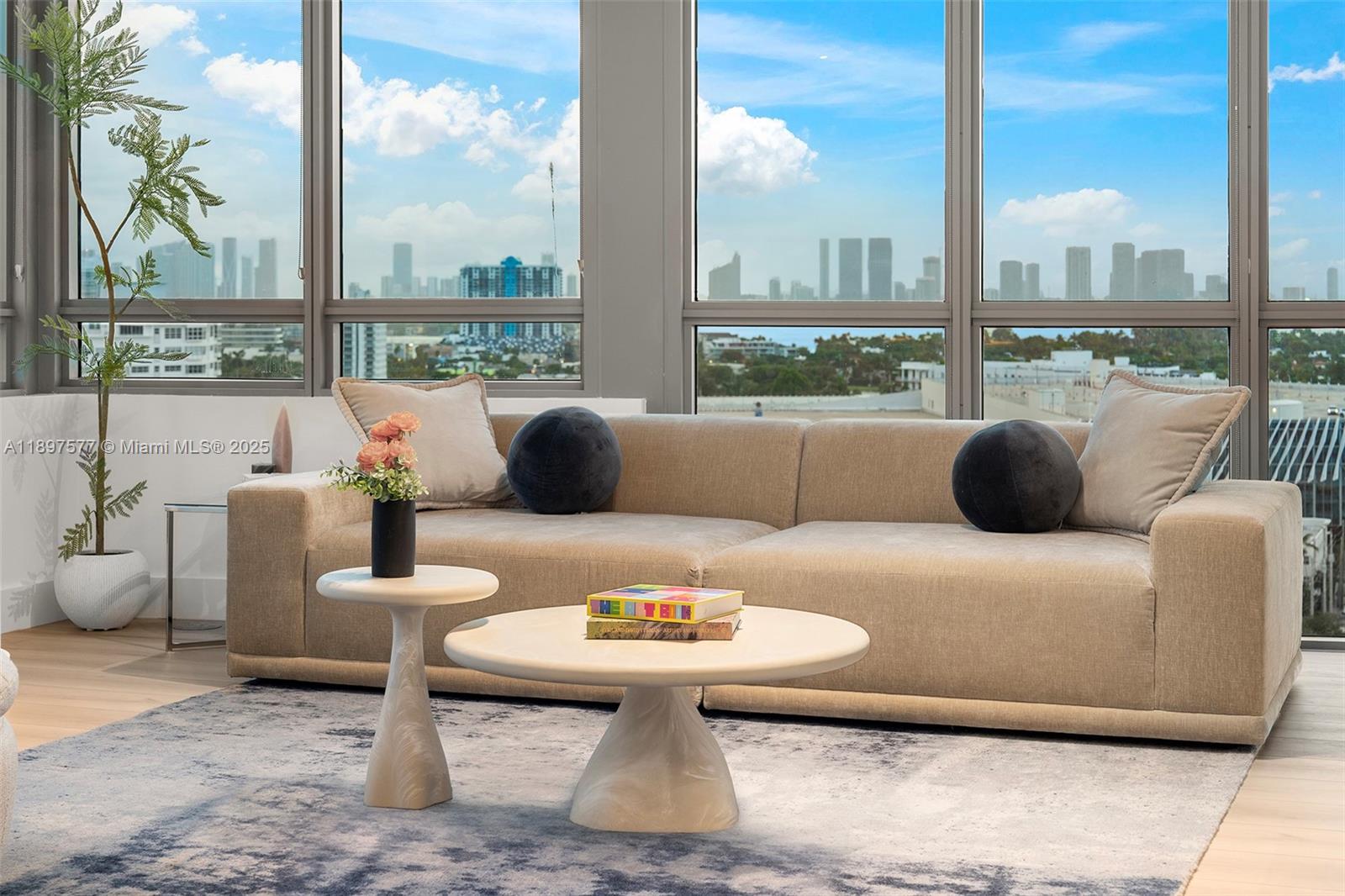 101 20th Street, Unit 2002 Miami Beach, FL 33139 - Photo 8 of 40 a living room with furniture and a floor to ceiling window