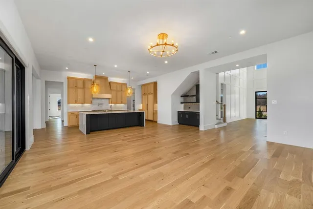 a view of kitchen and kitchen with a sink