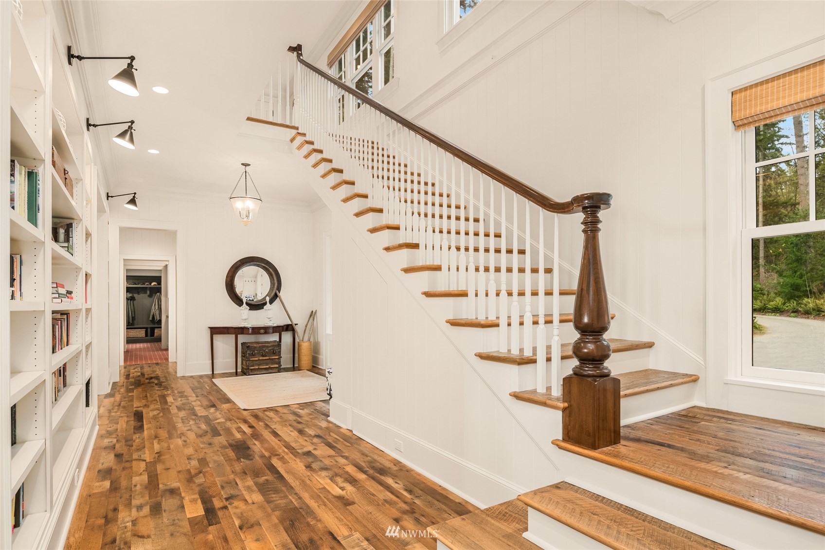 8143 Headlands Way Clinton, WA 98236 - Photo 14 of 26 a view of entryway kitchen and hall with wooden floor