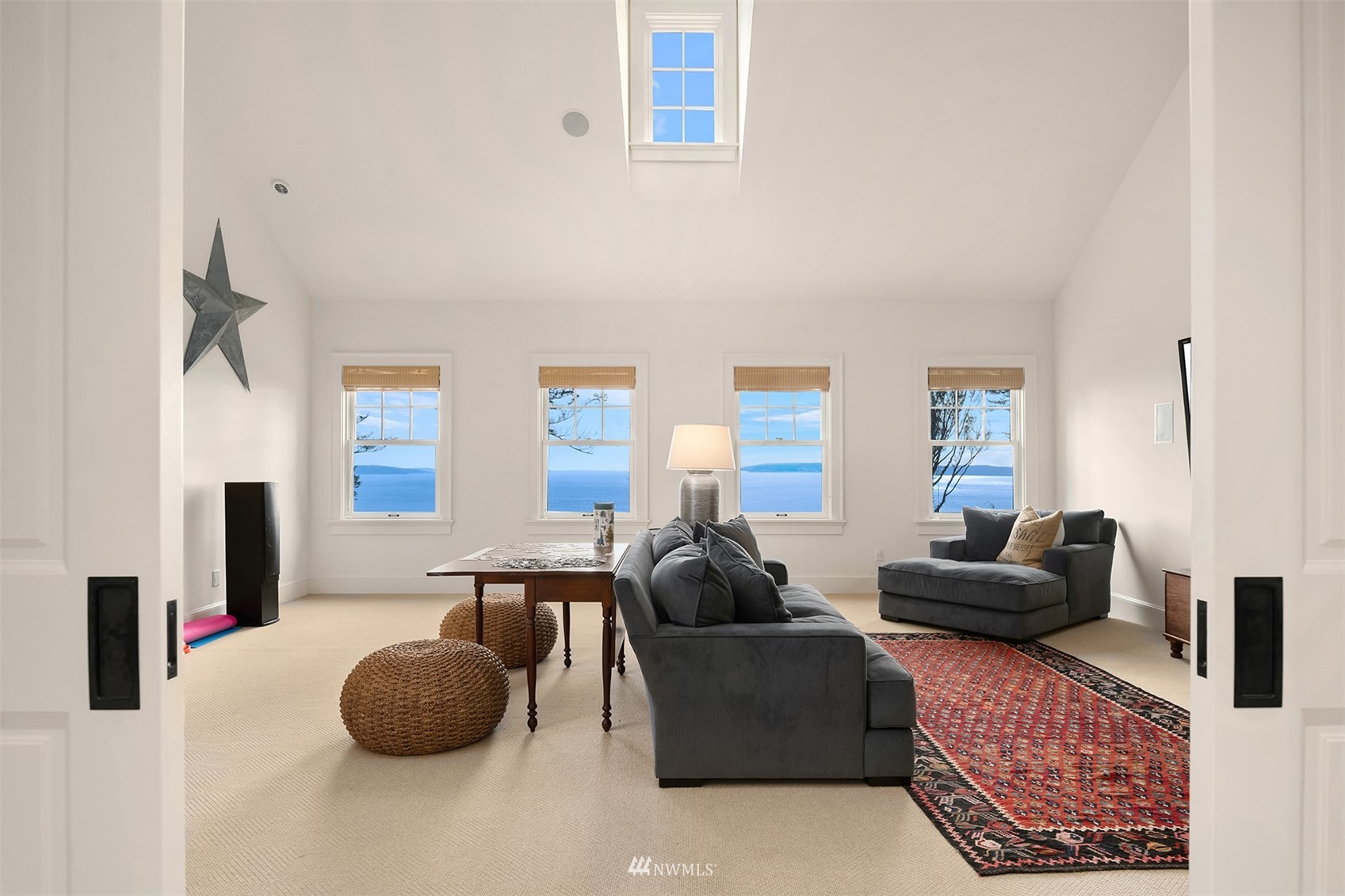 8143 Headlands Way Clinton, WA 98236 - Photo 15 of 26 a living room with furniture and a large window