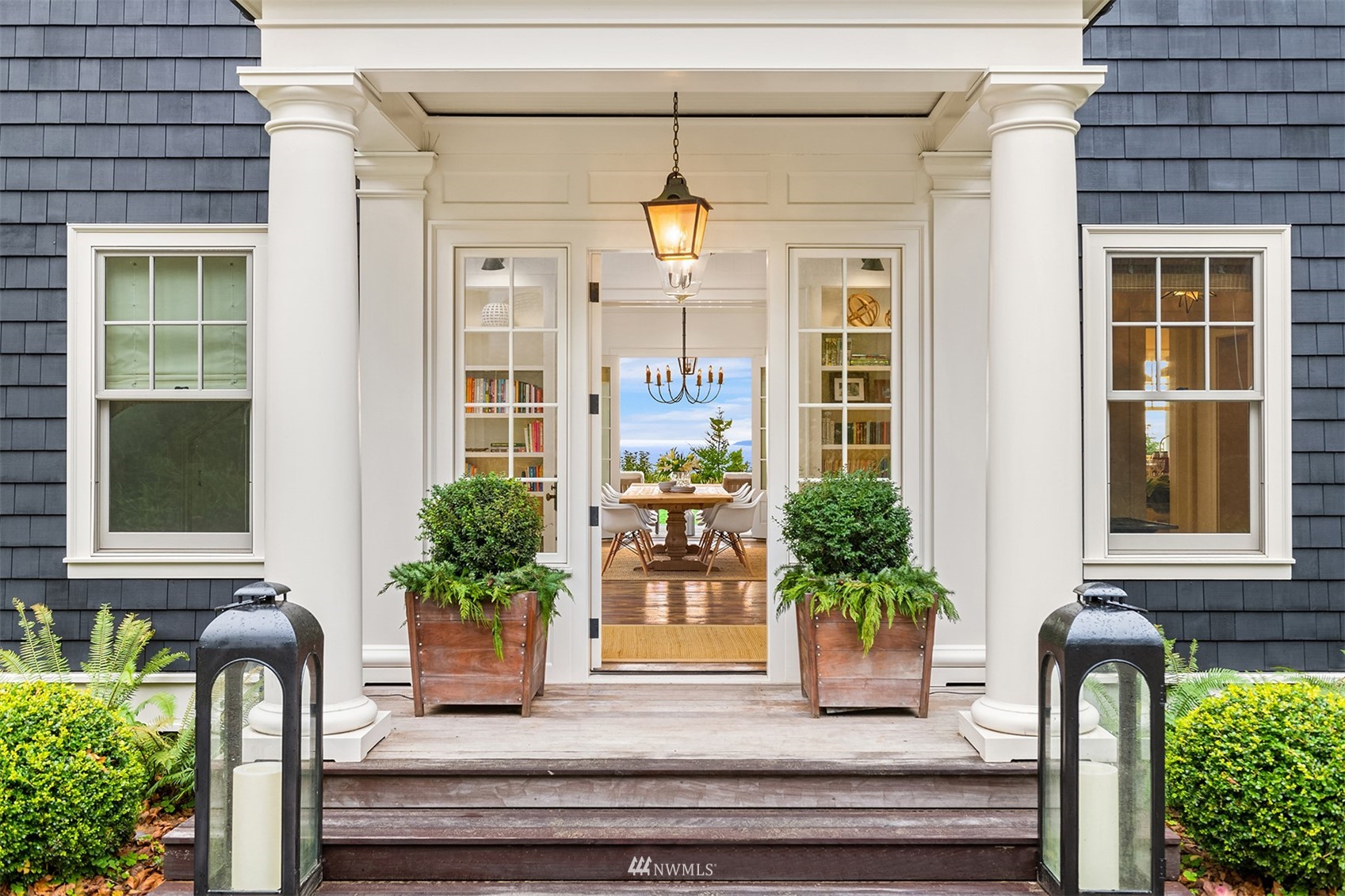 8143 Headlands Way Clinton, WA 98236 - Photo 2 of 26 a potted plant sitting in front of a house