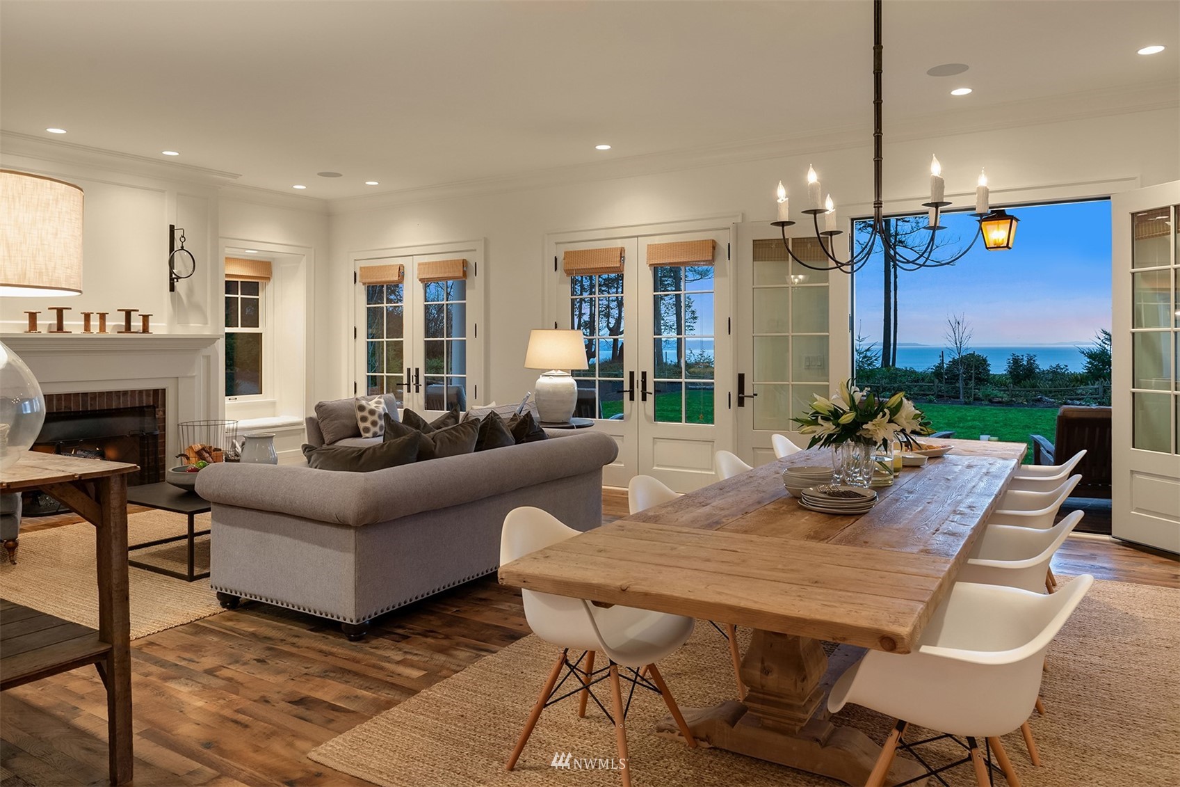 8143 Headlands Way Clinton, WA 98236 - Photo 4 of 26 a living room with furniture fireplace and dining table
