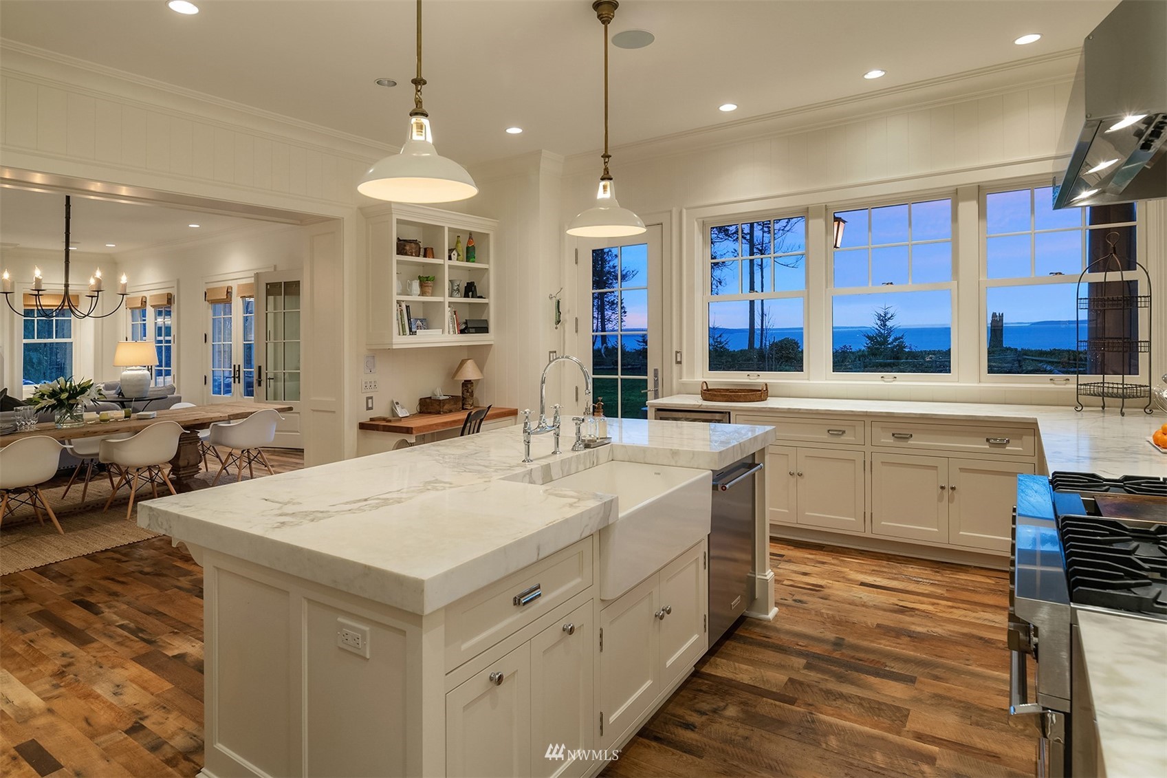 8143 Headlands Way Clinton, WA 98236 - Photo 6 of 26 a large kitchen with kitchen island a large island in it