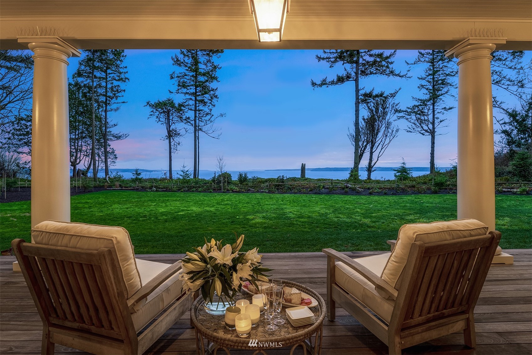 8143 Headlands Way Clinton, WA 98236 - Photo 9 of 26 a view of a patio with couches chairs and a fire pit