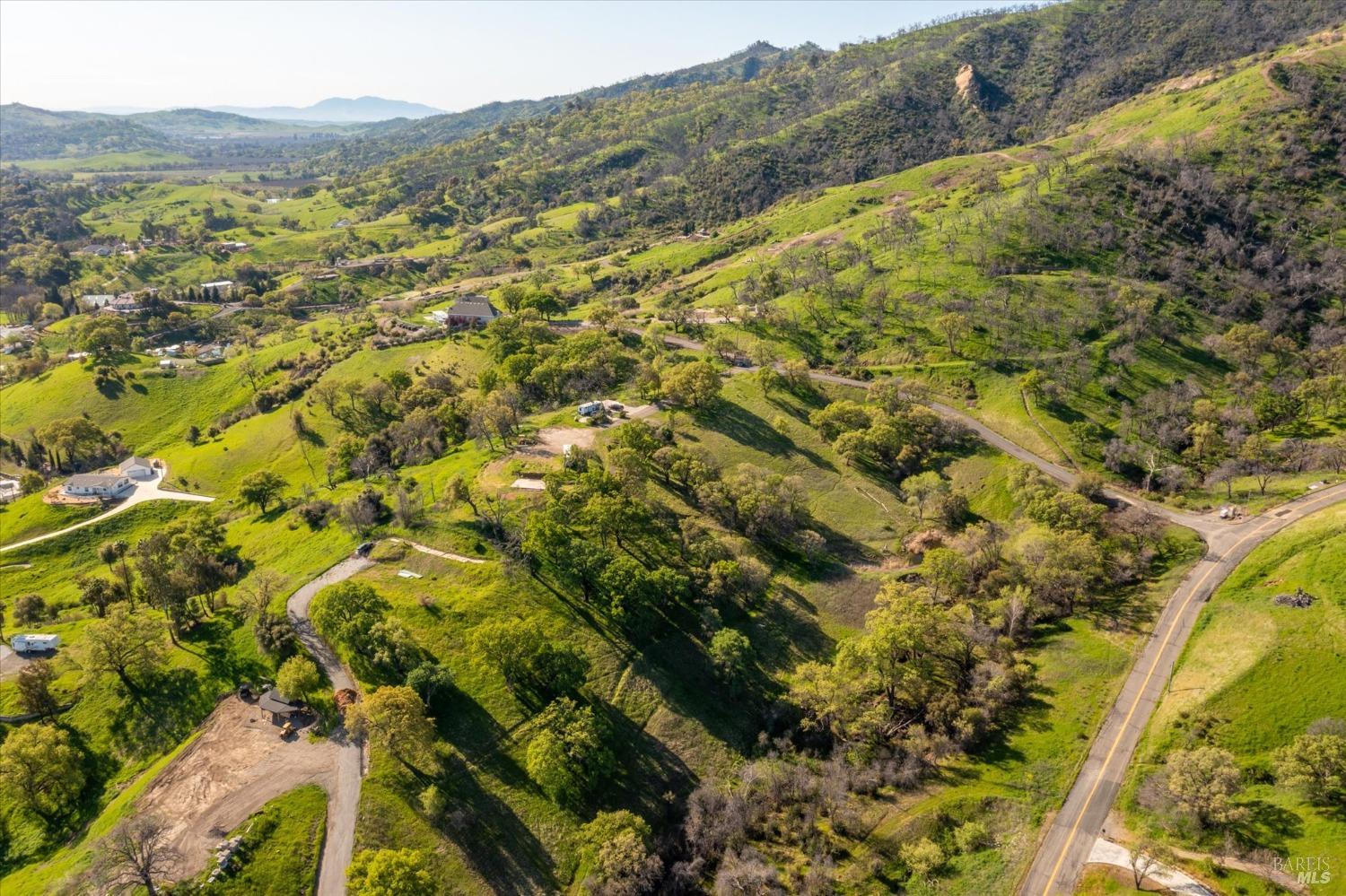 6958 Oak Tree Trail Vacaville, CA 95688 - Photo 23 of 24 a view of a forest with mountains in the background