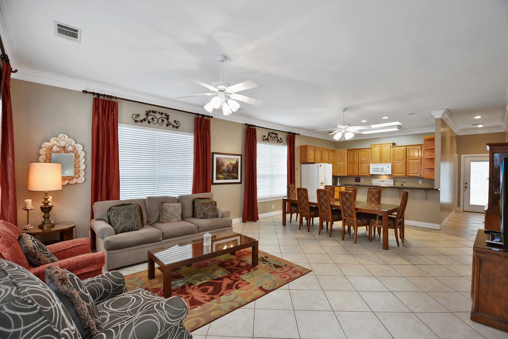 208 East 20th Street Cameron, TX 76520 - Photo 1 of 20 a living room with furniture potted plant and a window