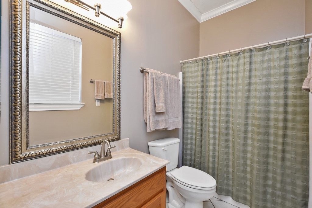 208 East 20th Street Cameron, TX 76520 - Photo 12 of 20 a bathroom with a sink toilet and shower
