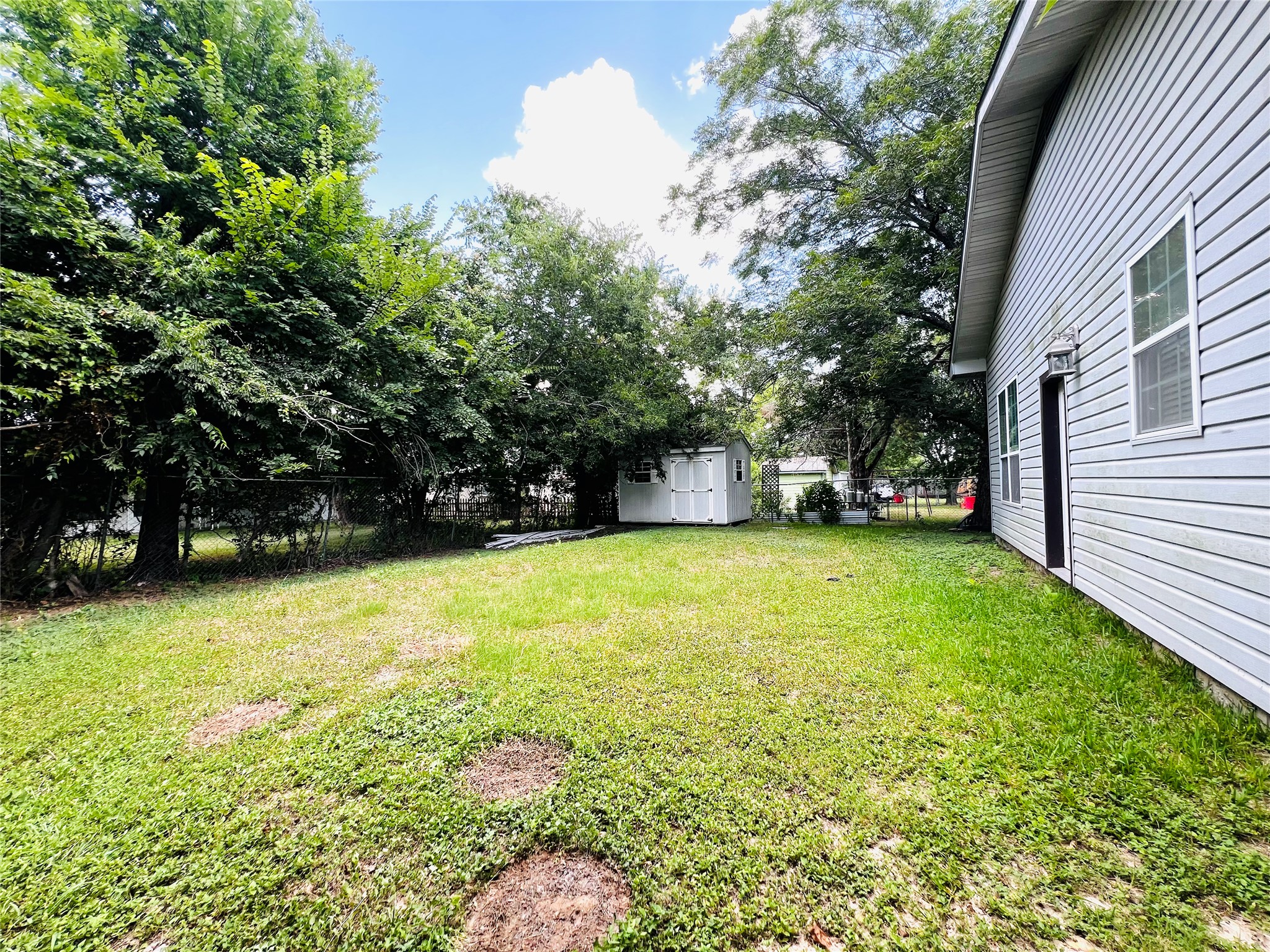 208 East 20th Street Cameron, TX 76520 - Photo 18 of 20 a view of a backyard with a garden