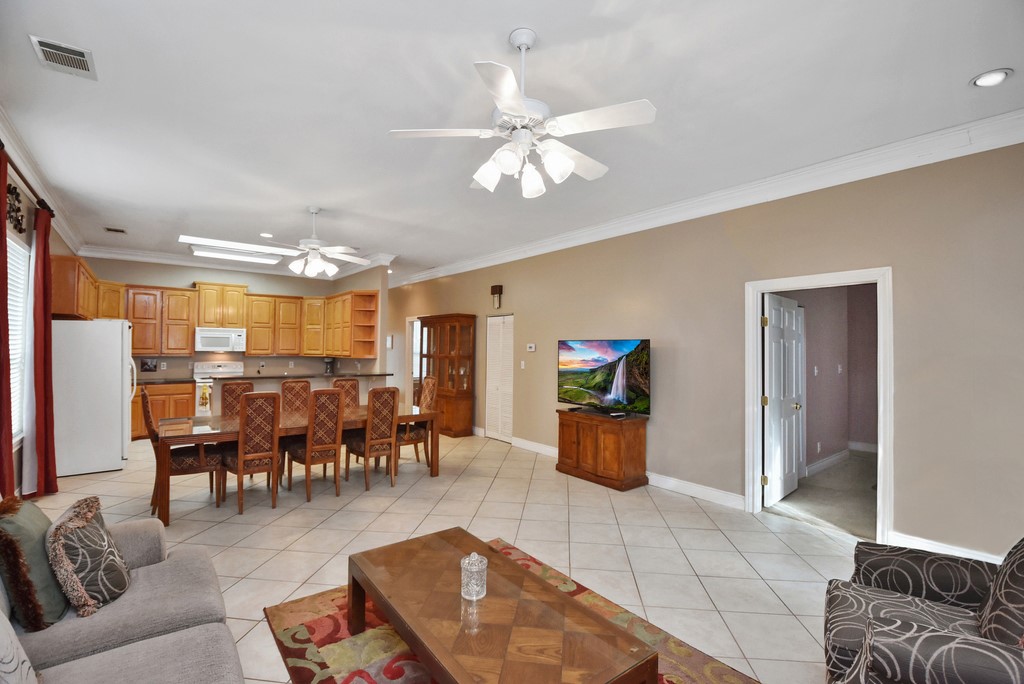 208 East 20th Street Cameron, TX 76520 - Photo 2 of 20 a living room with lots of furniture and kitchen view