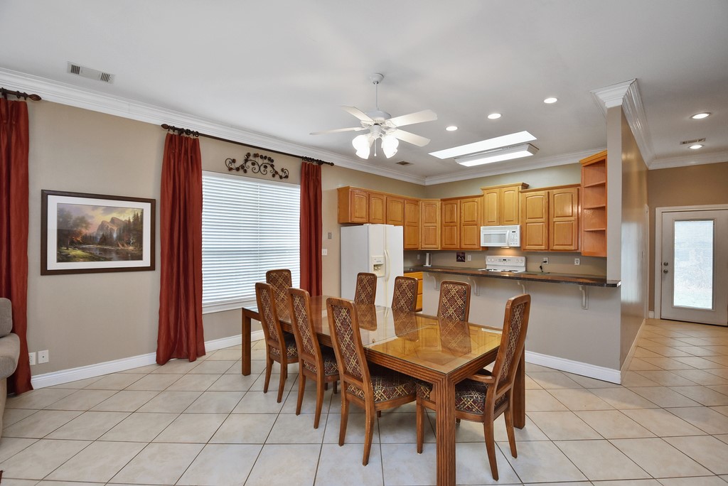 208 East 20th Street Cameron, TX 76520 - Photo 7 of 20 a view of a dining room with furniture and chandelier