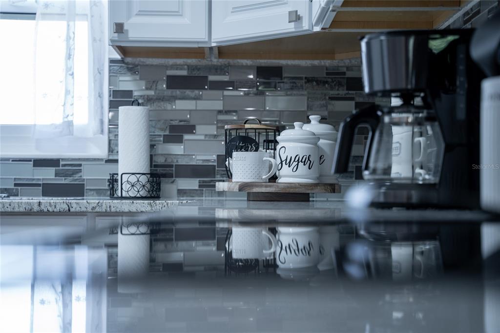 52 North York Road Avon Park, FL 33825 - Photo 13 of 44 a kitchen with a table and chairs in it