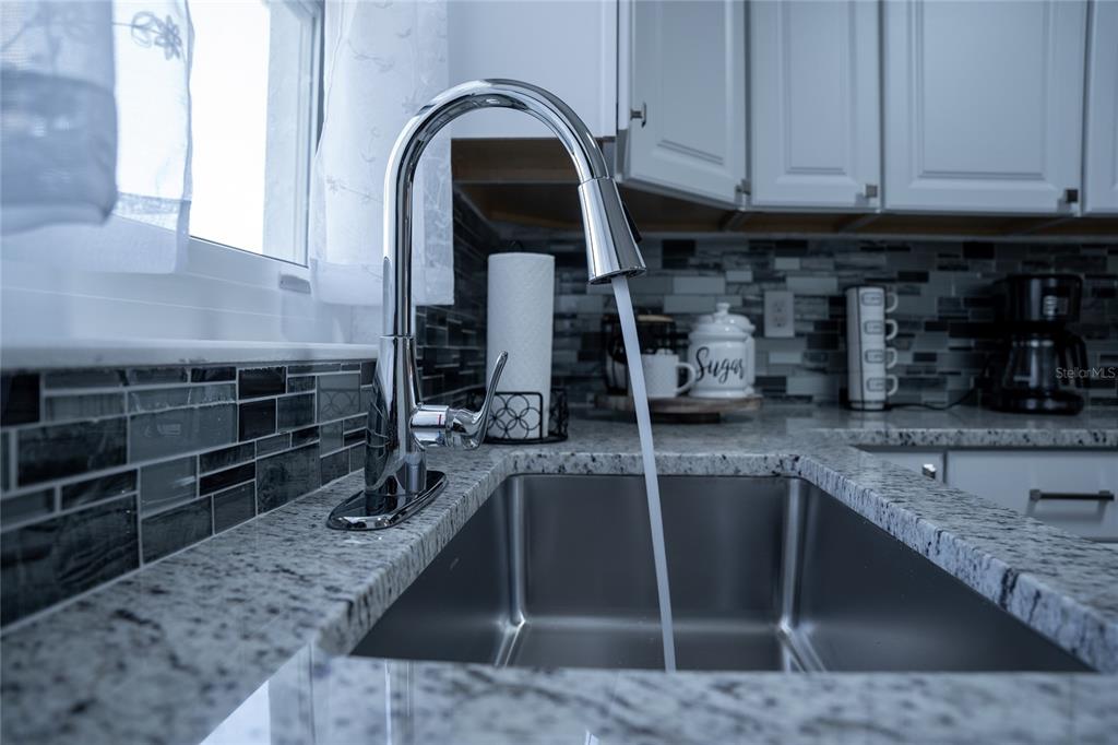 52 North York Road Avon Park, FL 33825 - Photo 15 of 44 a kitchen with a sink and cabinets