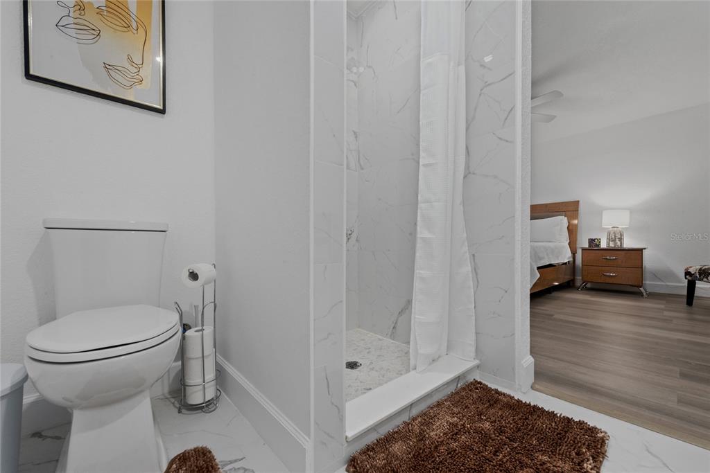 52 North York Road Avon Park, FL 33825 - Photo 27 of 44 a bathroom with a toilet and a shower