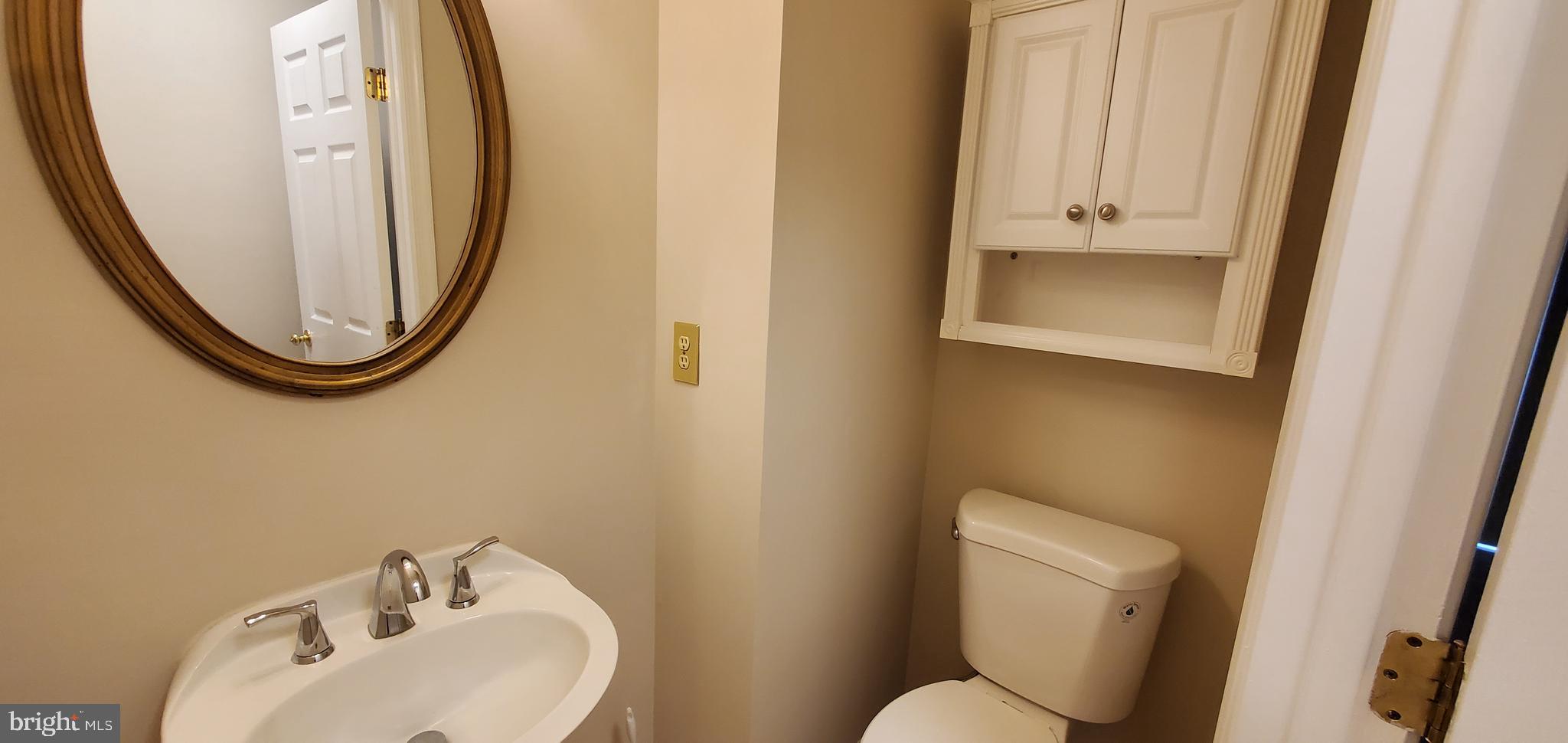 106 Lindenridge Road Laurel, MD 20724 - Photo 11 of 17 a bathroom with a toilet and a sink