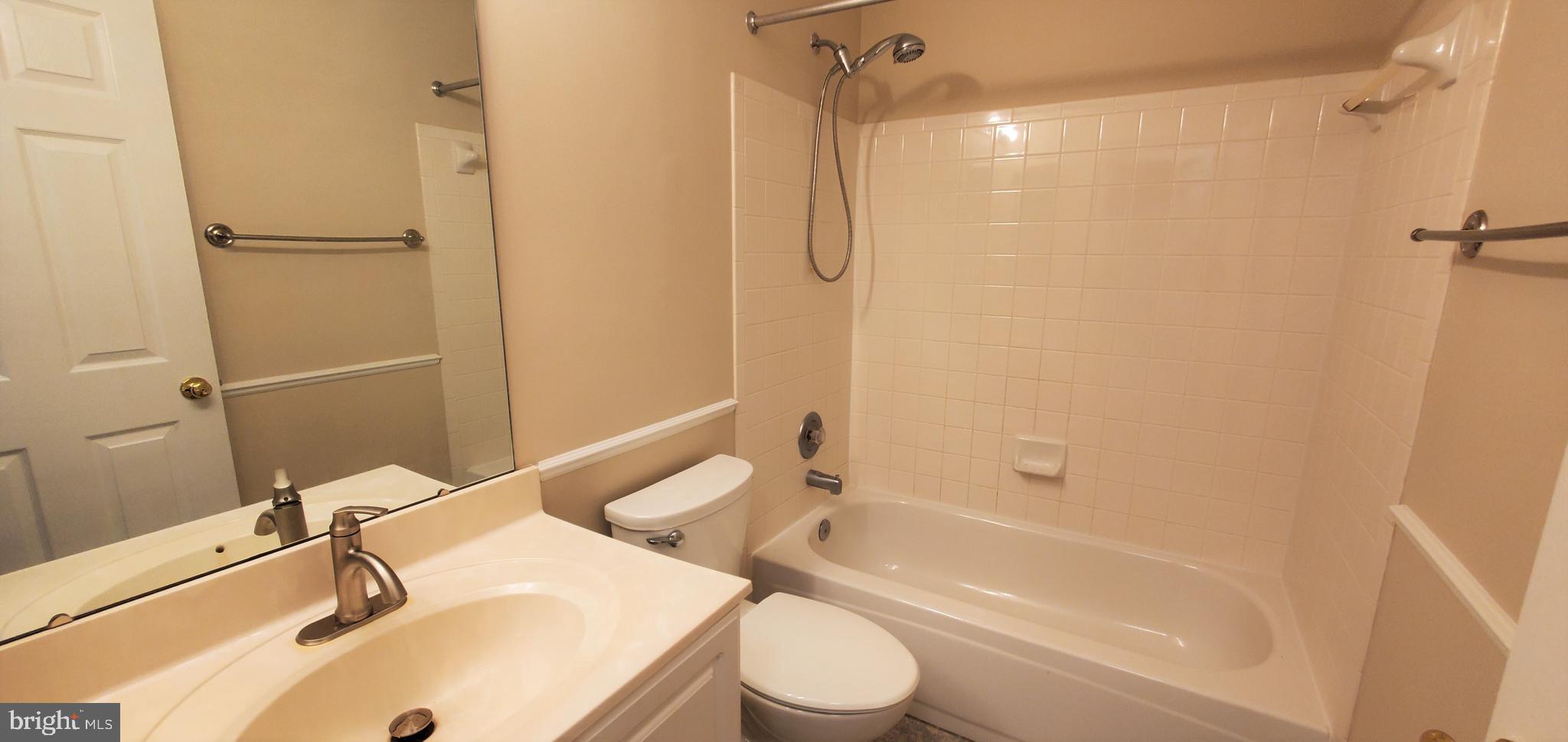 106 Lindenridge Road Laurel, MD 20724 - Photo 12 of 17 a bathroom with a sink toilet and shower