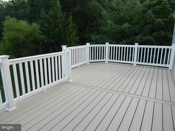 106 Lindenridge Road Laurel, MD 20724 - Photo 2 of 17 a balcony with wooden floor