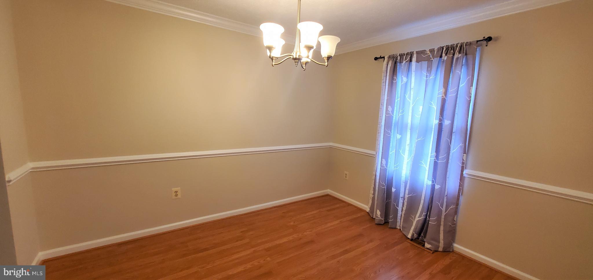 106 Lindenridge Road Laurel, MD 20724 - Photo 9 of 17 a view of a chandelier in an empty room