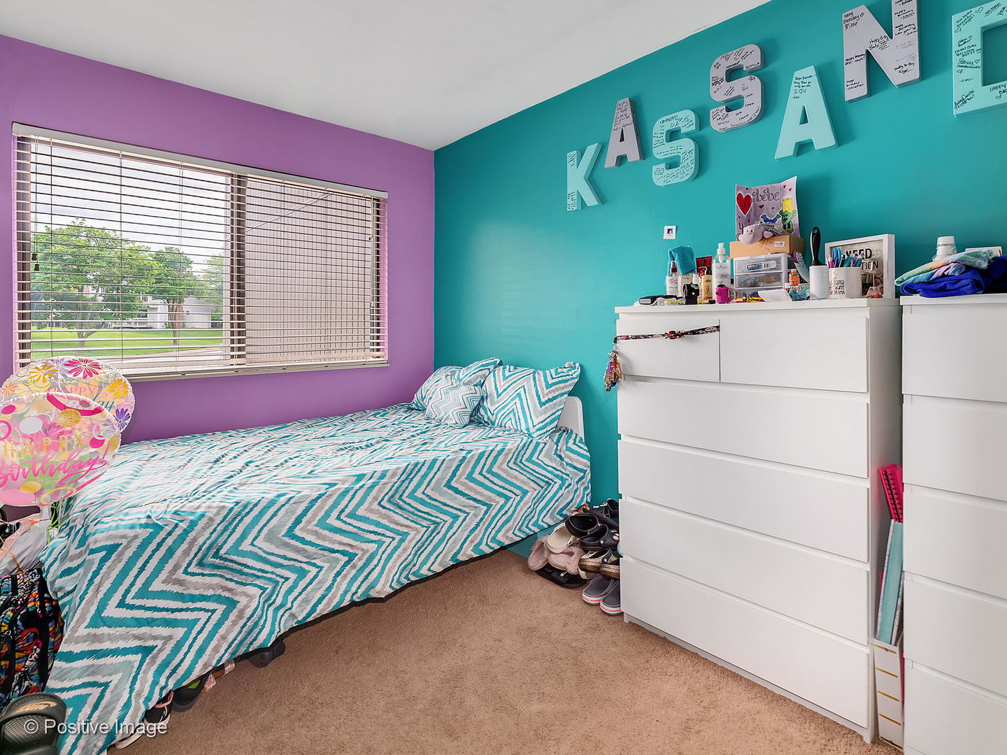 773 High Ridge Road Roselle, IL 60172 - Photo 12 of 18 a bedroom with a bed and a window